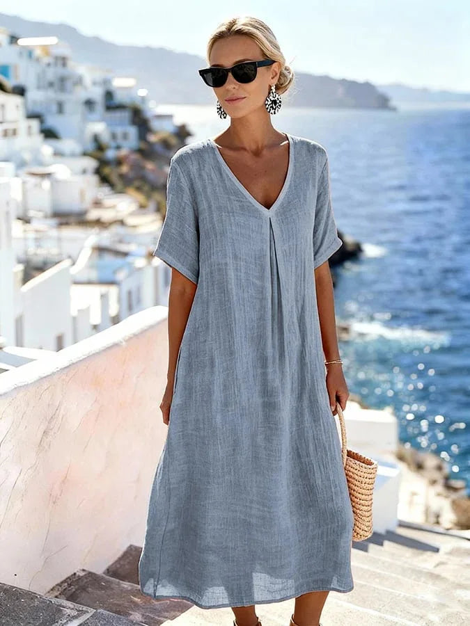 Effortlessly chic women's v-neck midi dress, short sleeves, flowing silhouette for summer comfort.