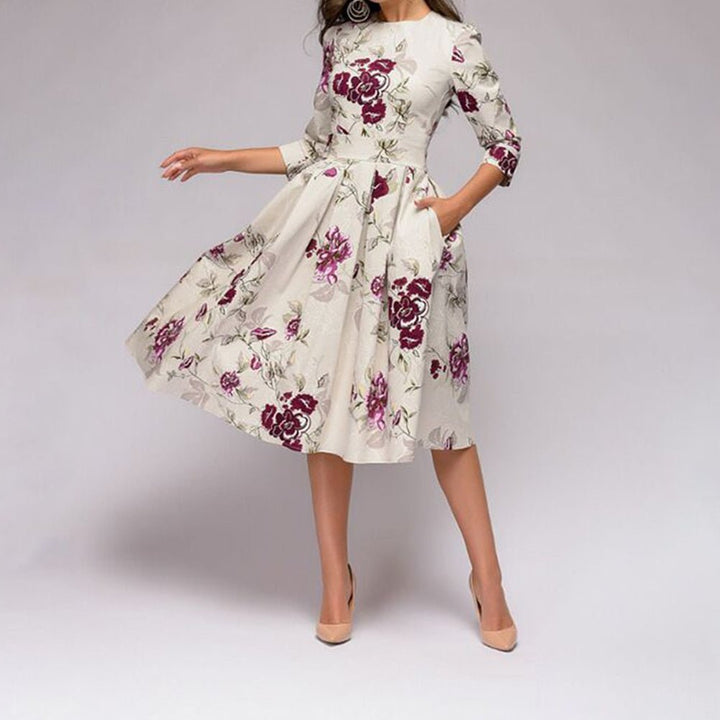 Flattering vintage A-line midi dress for women, featuring chic 3/4 sleeves and a retro design.