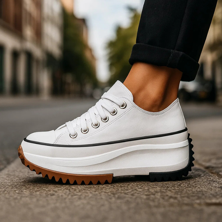 Comfortable women's platform sneakers with retro design, lace-up closure & cushioned sole for daily wear.
