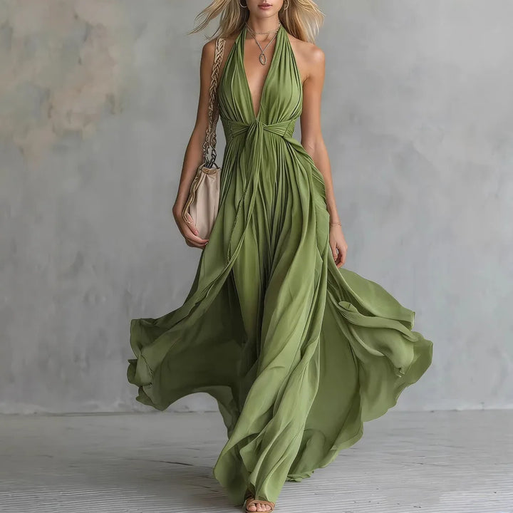 Stunning Roselyn women's flowy pleated backless maxi dress. Elegant halter neck evening gown for formal events.