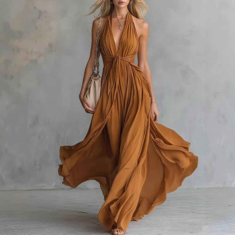 Women's Roselyn evening maxi dress. Pleated, flowy, and backless design with halter neck. Formal party special occasion.