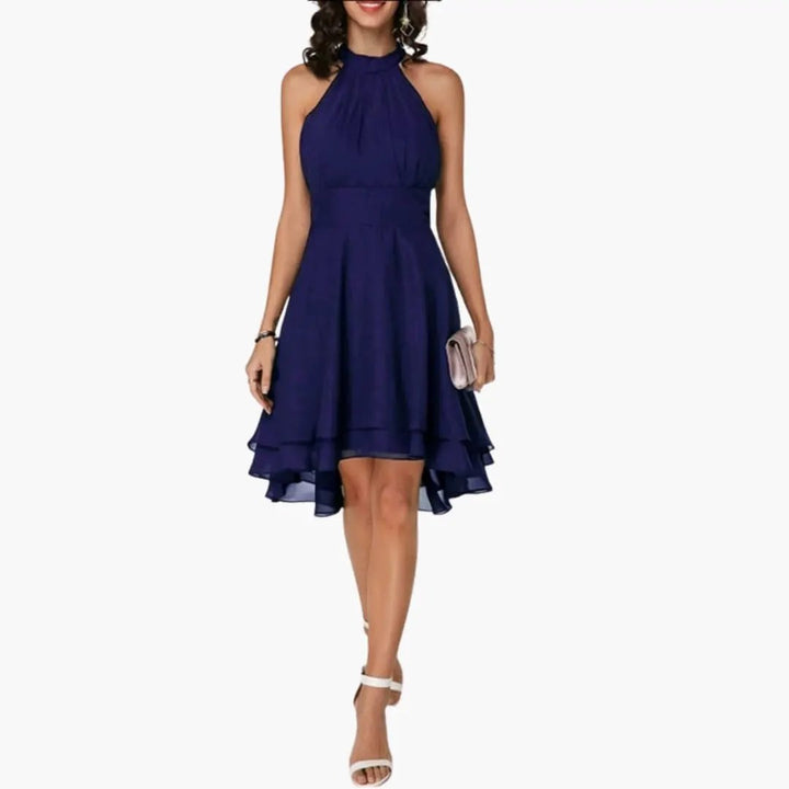 Versatile women's dress: round neck, sleeveless, with charming ruffle details. Knee-length, great for summer casual looks.