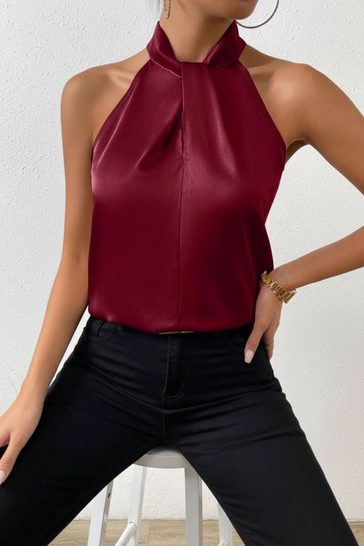 Women's casual chic sleeveless halter blouse with a flattering sculpted fit & stylish knot detail.