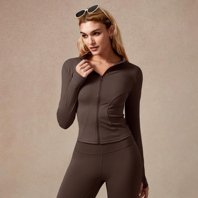 Stylish women's gymwear: a sculpted zip performance workout shirt, long sleeve, for training & yoga.