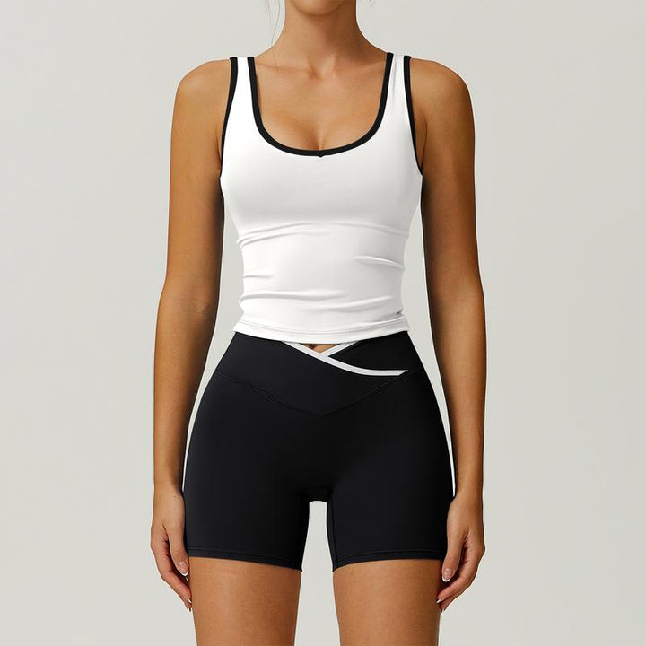Women's sculpting activewear set with high-waisted shorts & matching tank top for gym workouts & fitness.