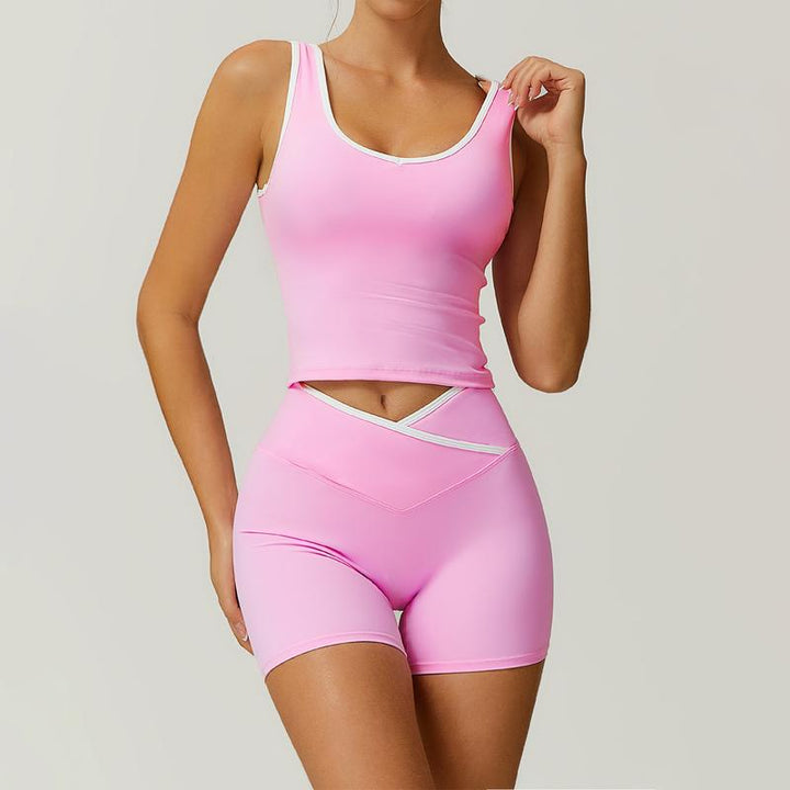 Performance women's high-waisted activewear shorts and tank set, designed for intense workouts.