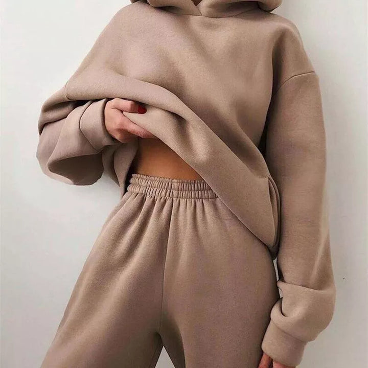 Stylish women's athleisure two-piece set: ultra-soft hoodie & joggers, perfect for casual or active wear.