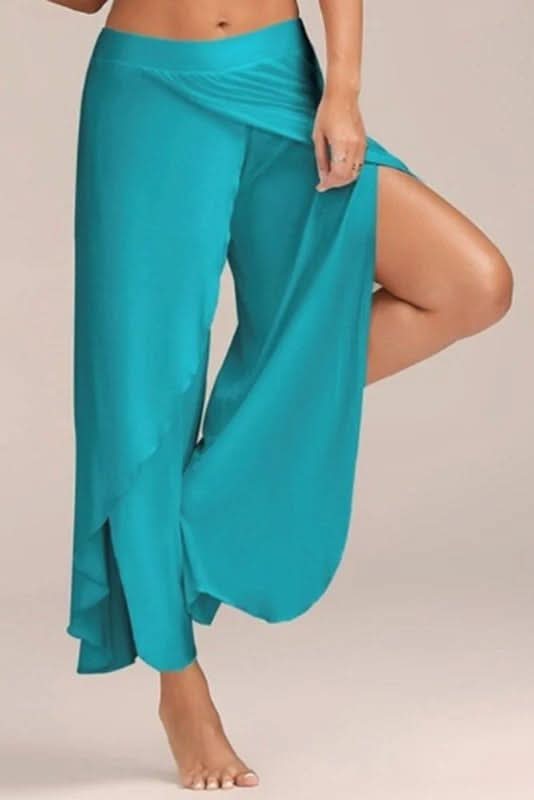 Woman modeling sleek high waisted yoga pants, showing flexible fit for all women's fitness activities.