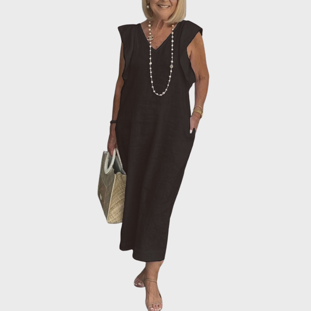 Perfect vacation women's maxi dress. Sleeveless V-neck design with ruffle shoulders and side pockets.