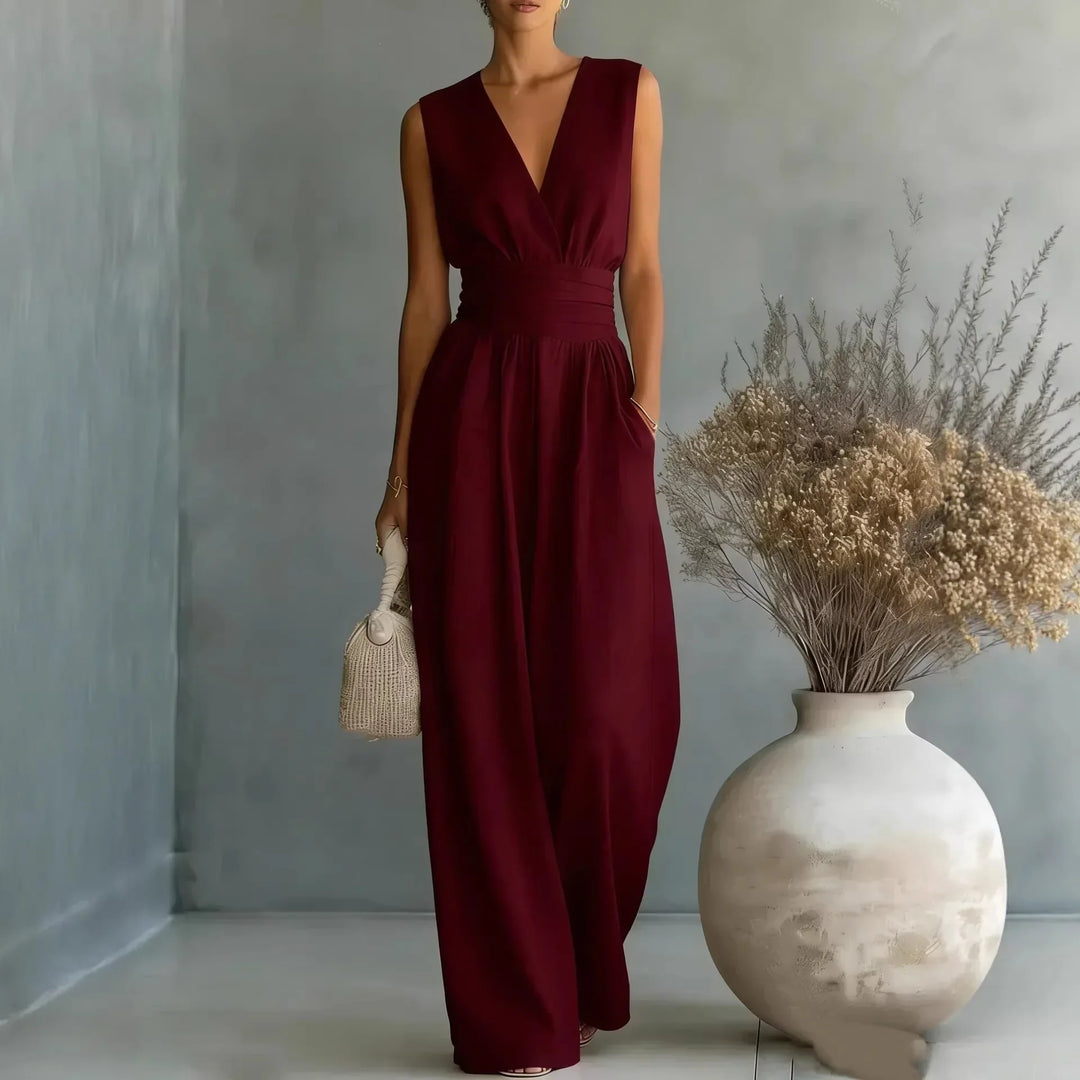 Chic women's sleeveless V-neck wide-leg jumpsuit with a high waist and flowy fabric for comfortable summer style.