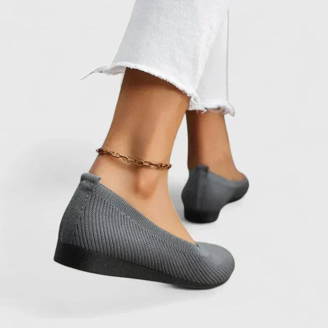 A pair of women's comfortable slip-on shoes with orthopedic features & arch support, ready for daily walking.
