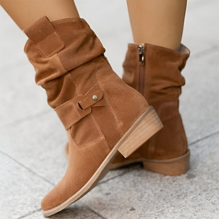 Versatile women's ankle boots, slouchy style with a practical low heel and adjustable buckle strap.