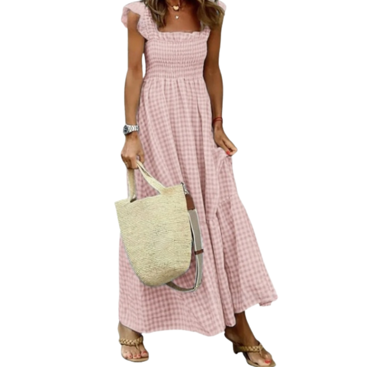 Effortless women's spring/summer smocked maxi dress with a tiered skirt. Elegant and comfortable for any occasion.