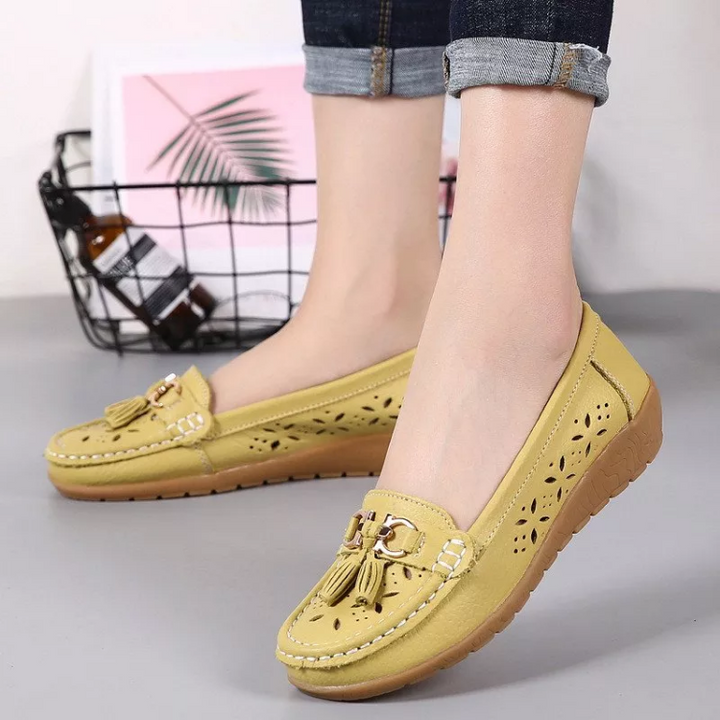 Comfortable slip-on women's moccasin sandals with arch support, ideal for casual summer style.