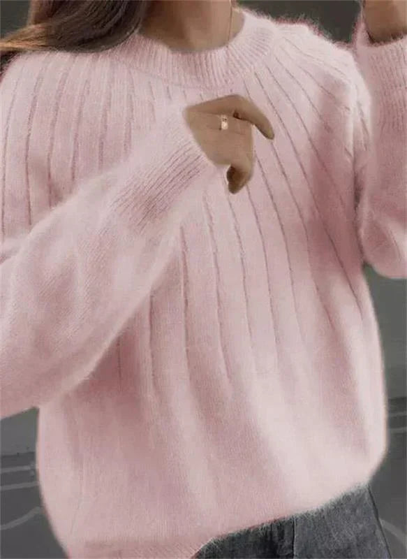 Stylish women's textured knit pullover sweater. Comfortable & soft long-sleeve winter apparel.