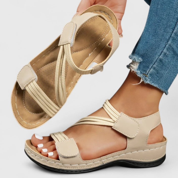 Top view of women's elegant slip-on sandals, emphasizing arch support & comfortable design.