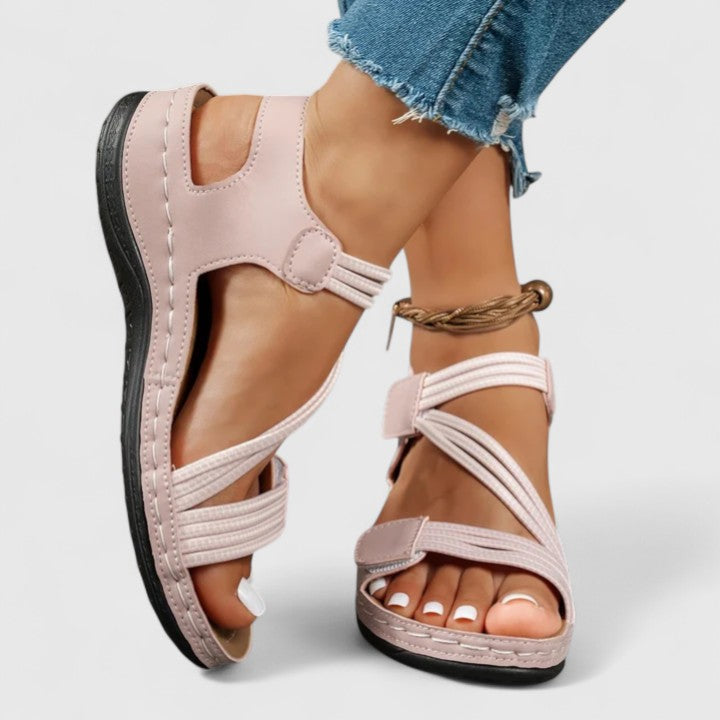 Sophisticated slip-on women's sandals, combining style with orthopedic arch support.