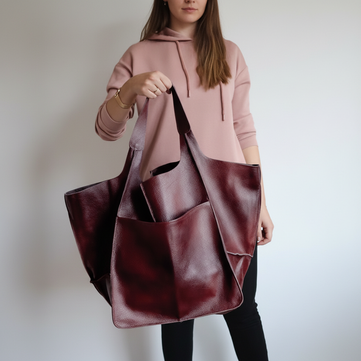 Interior view of the large capacity vegan leather tote, showing organized compartments for essentials.