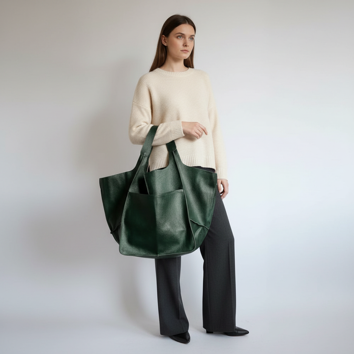 Women's sophisticated faux leather shoulder bag. This spacious everyday tote combines style with practical utility.