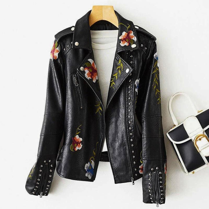 Unique women's statement jacket with detailed floral embroidery and striking studs for an edgy, fashion-forward look.