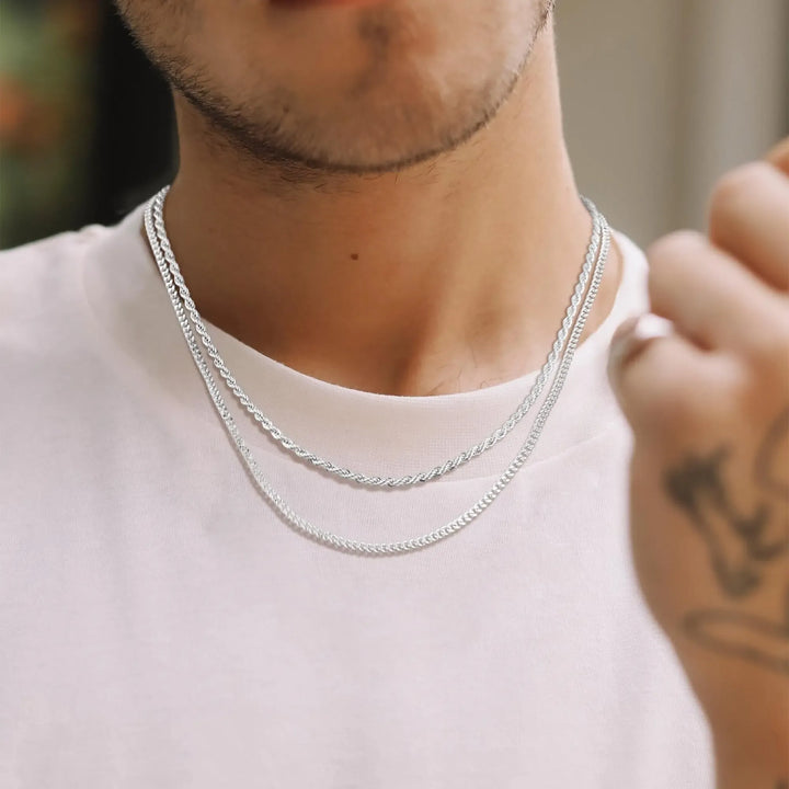 Elegant women's sterling silver double chain necklace. Layered curb & rope chains for a chic silver accessory.
