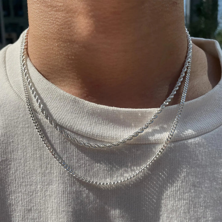 Close-up of women's sterling silver double chain necklace, showcasing the intricate curb & rope chain details.