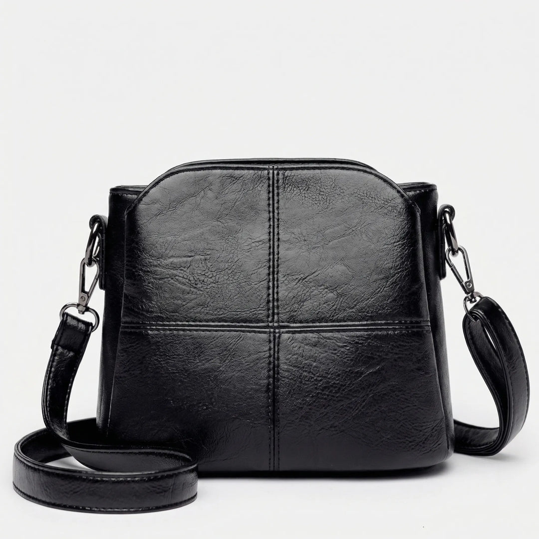 Fashionable women's shoulder bag, a compact crossbody with elegant stitched design. Ideal day or evening accessory.