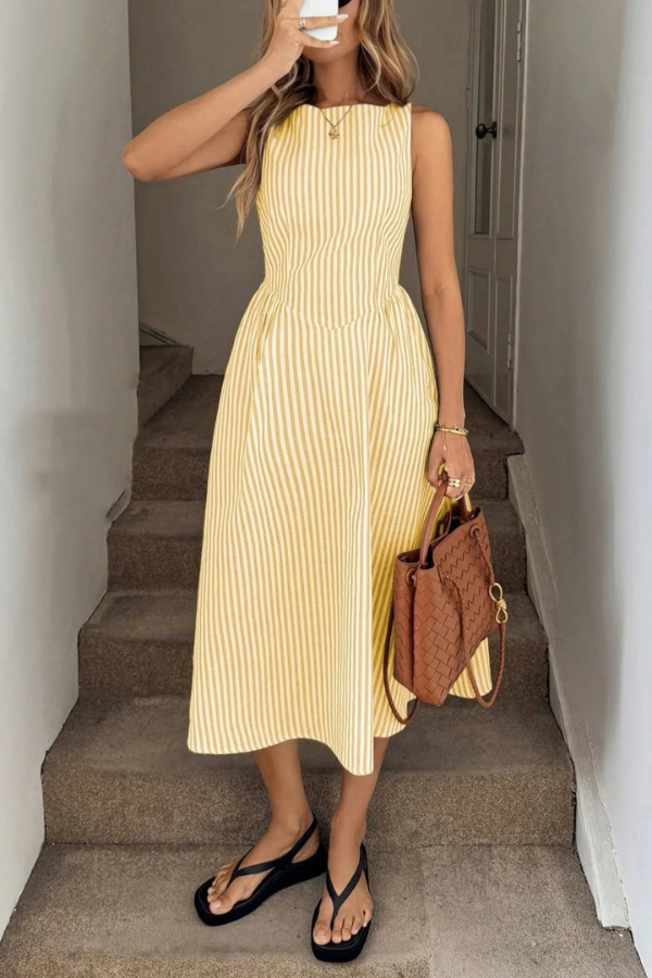 Elegant women's striped midi halter dress, ideal for summer vacations & casual wear. Pleated details.