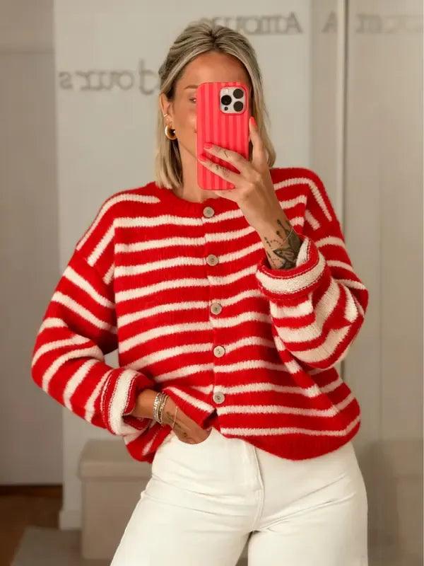 Woman wearing a striped knit cardigan, long sleeve, button-front. Effortless, comfortable style for fall & winter.