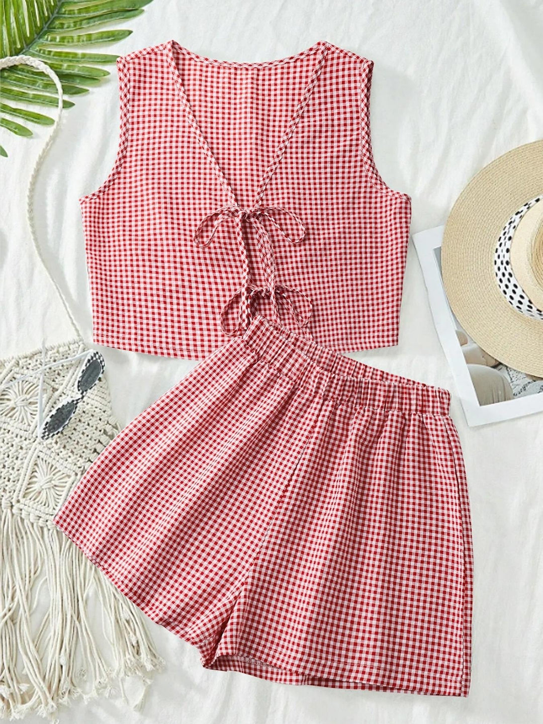Stylish women's striped two-piece lounge set with relaxed fit crop top & shorts for ultimate summer comfort.