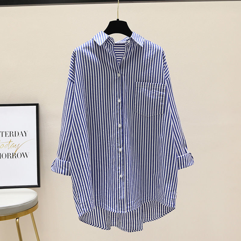 Stylish women's striped oversized button-down shirt, perfect for casual outings or a chic preppy look. Everyday wear.