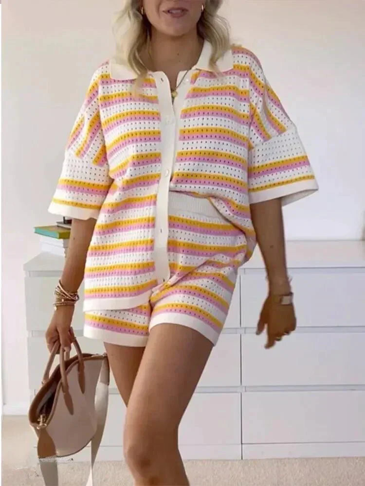 Relaxed fit women's striped two-piece short set. Features a button-up top & elastic waist shorts.