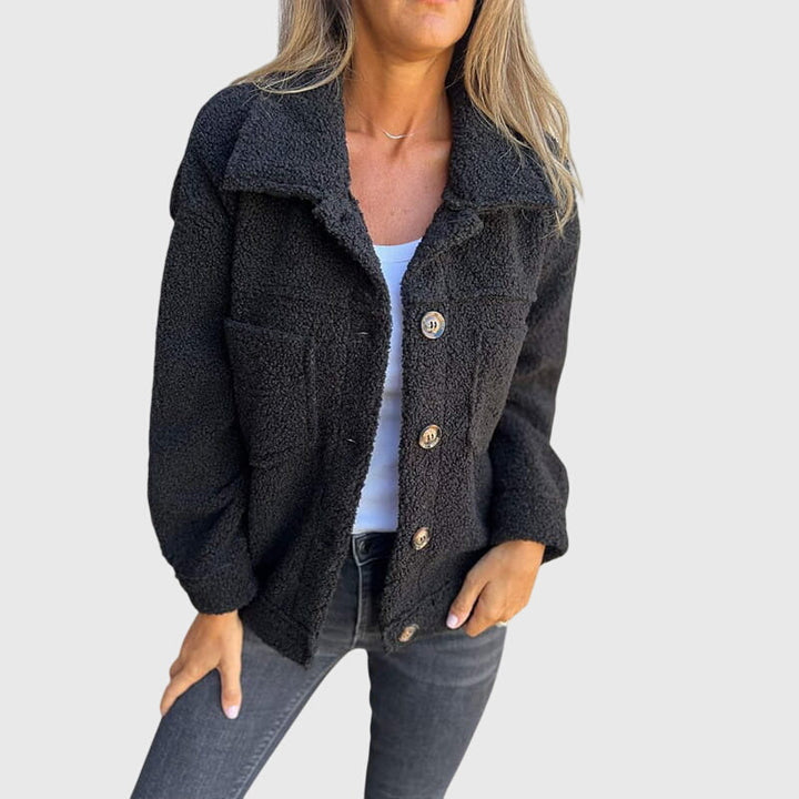 Women's stylish fall jacket, elegant button closure, practical pockets, perfect for everyday chic.