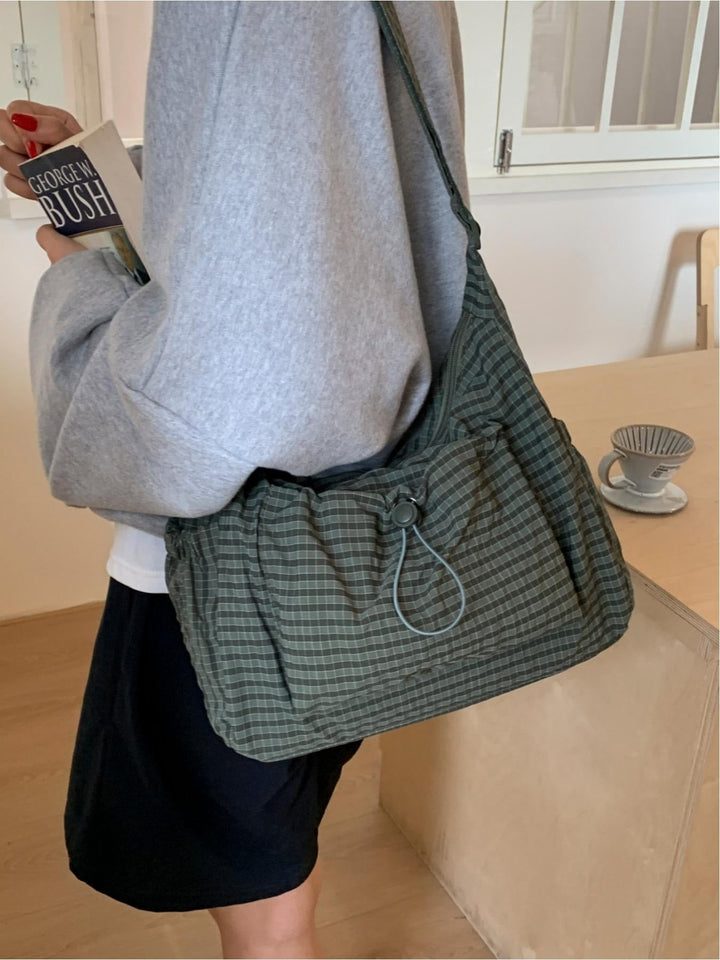 Ruched women's shoulder bag: a casual gingham canvas design for comfortable everyday fashion.