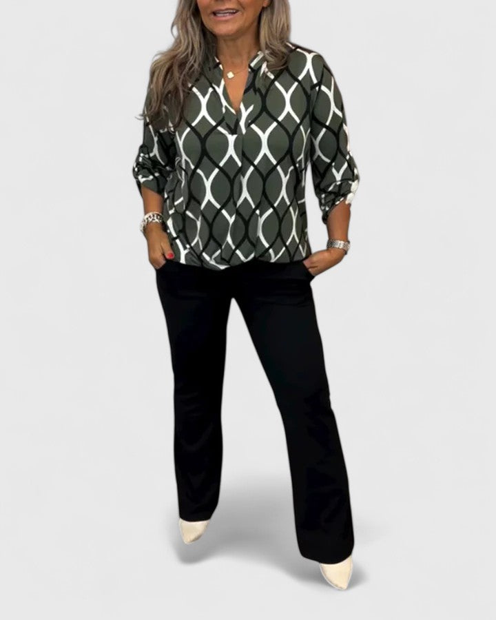 Chic women's blouse featuring a unique graphic print, perfect for a stylish yet effortless casual look.