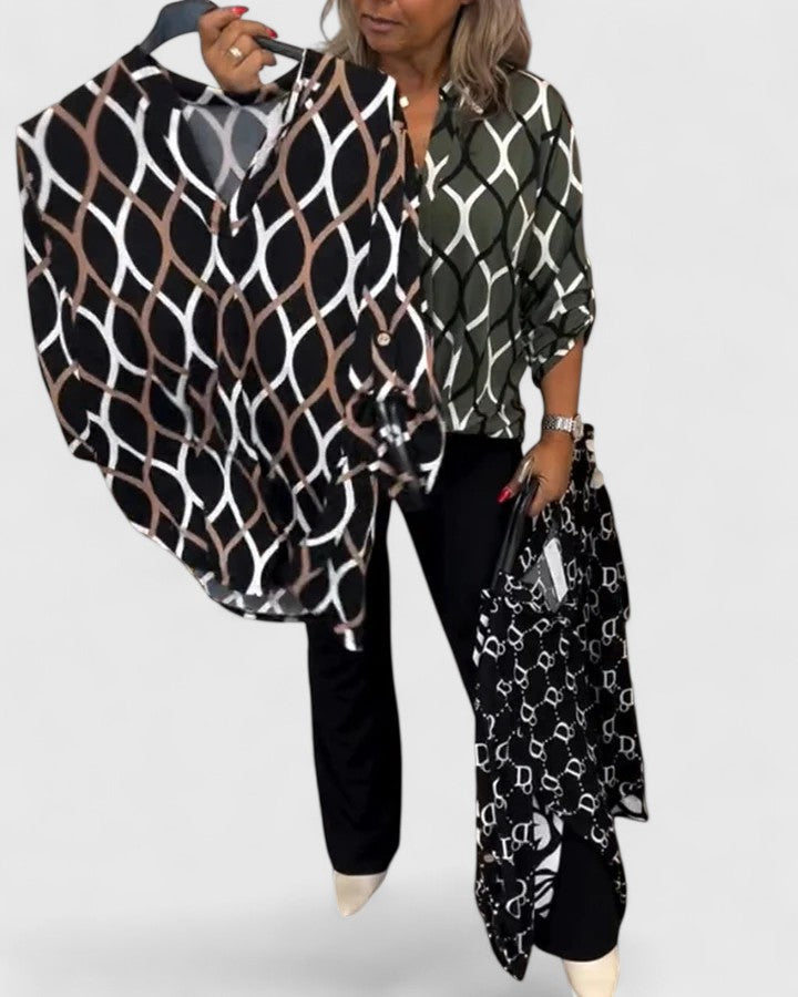 Trendy women's graphic print top with three-quarter sleeves, offering a stylish loose fit and effortless comfort.
