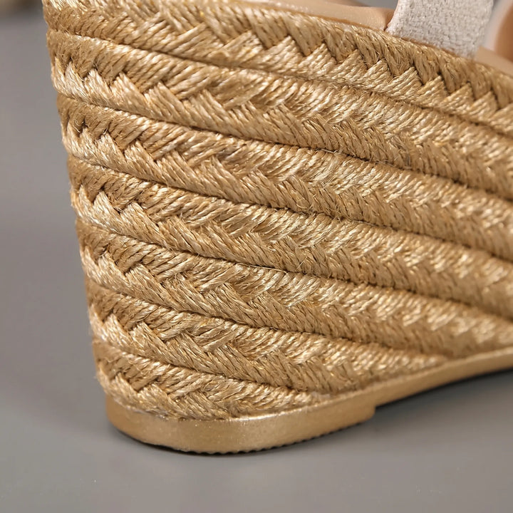 Elegant beige open-toe platform wedge sandals for women. Ideal stylish summer footwear, offering comfort and a retro vibe.