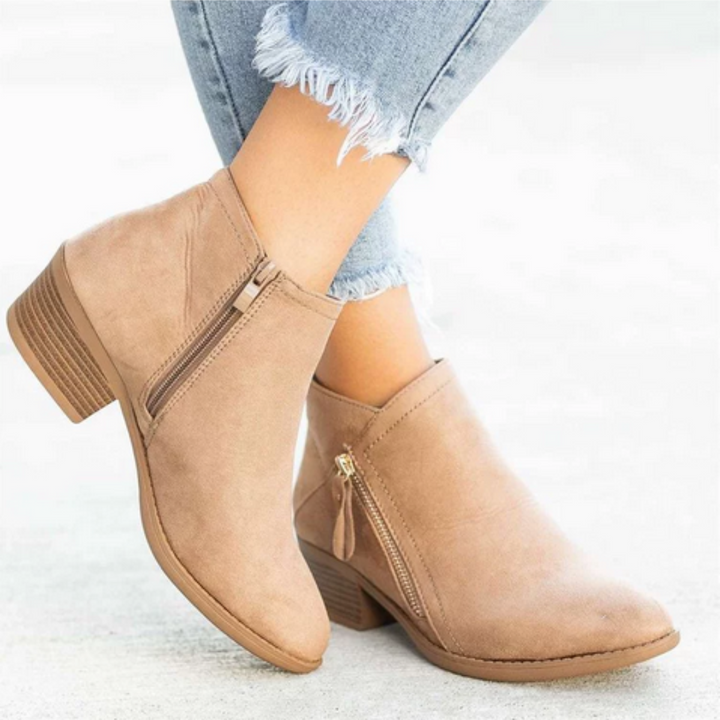 Side view of women's comfortable waterproof zipper boots, ideal for stylish walking & daily activities.