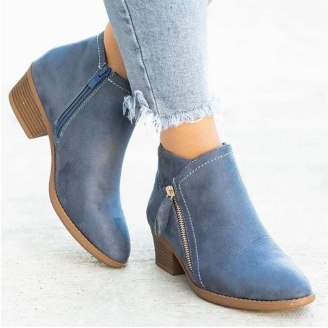 Close-up of waterproof material on women's ankle boots, ensuring dry and comfortable footwear in any weather.