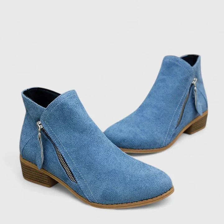 Back view of women's supportive waterproof ankle boots, featuring a sleek design for everyday style.