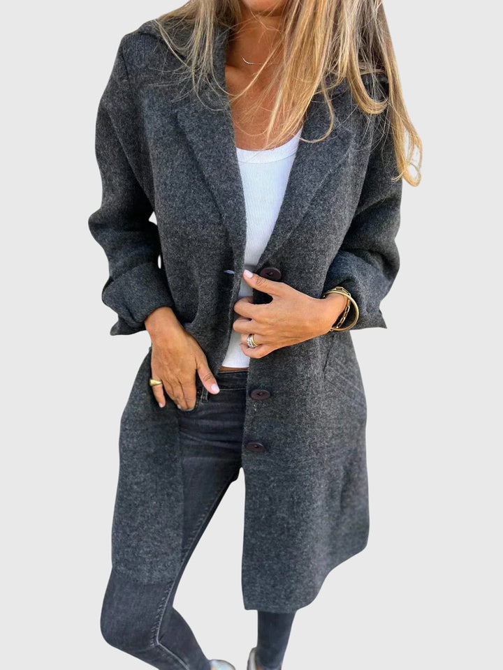 Side profile of a women's tailored button blazer, ideal versatile outerwear for chic work wear and fashion.
