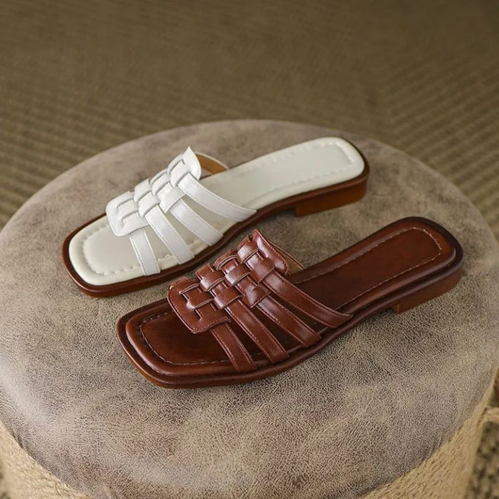 Tivra Geo Cutout women's slide sandals, featuring a stylish geometric design, cushioned comfort, and flat sole.