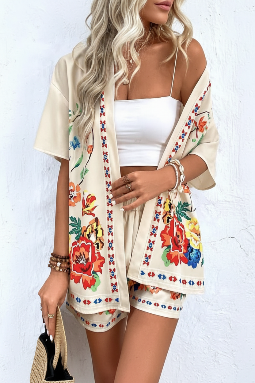 Chic women's tropical floral print two-piece summer outfit set with short sleeve top and shorts.