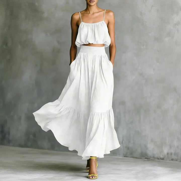 Versatile women's two-piece crop top and maxi skirt set with ruffle hem, ideal for summer holidays & beach wear.