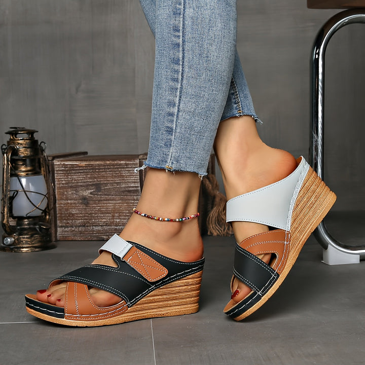 Soft, comfortable women's two-tone wedge slides. Slip-on summer sandals with open toe for ease.