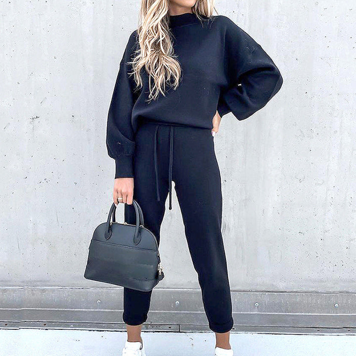 Stylish women's ultra-soft loungewear set with an oversized sweater & high-waist pants for daily comfort.