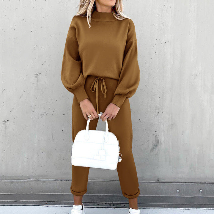 Two-piece women's loungewear set featuring a soft oversized sweater & high-waist pants for ultimate comfort.