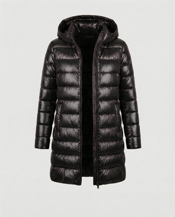 Transitional women's insulated hooded jacket, packable & lightweight for outdoor adventures.