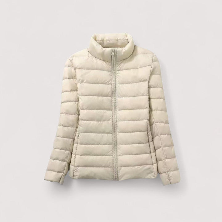 Women's ultralight jacket, a warm travel essential, ideal for cold weather adventures.
