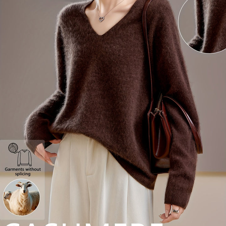 Close-up of soft knit V-neck on an elegant women's oversized sweater, perfect for autumn layering.